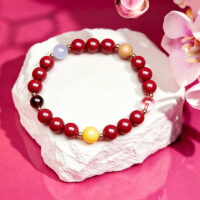 genuine red cinnabar bracelet on white background