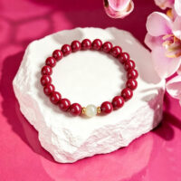 genuine red cinnabar healing bracelet on white background