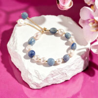 red and yellow crystal bracelet on white background